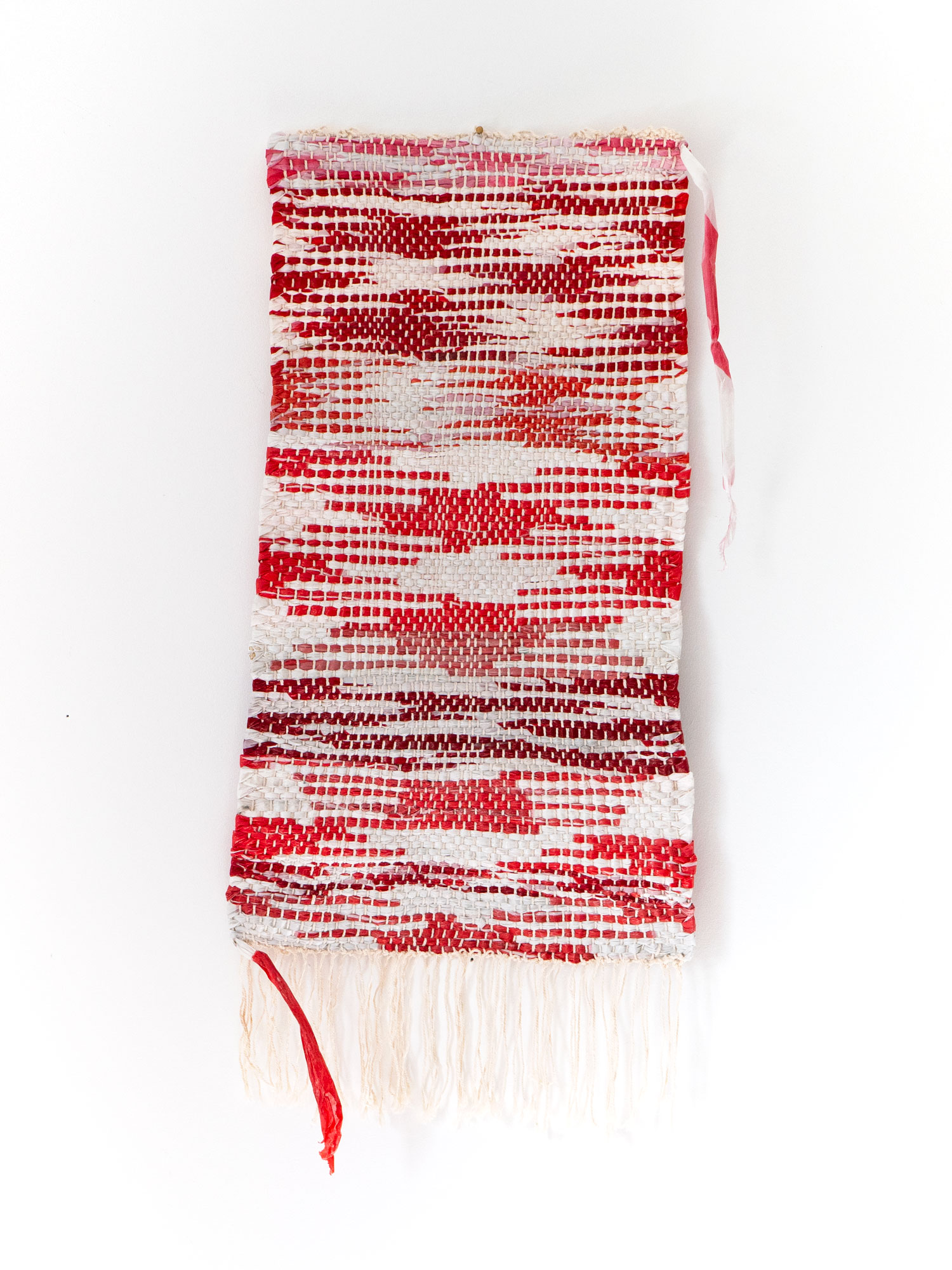 TRASHFLOW – transformation rag rug, 2025 (~40 x 65 cm, barrier tapes found in Vienna, Budapest, Brussels, Paris, Belgrade, Freistadt, Bukarest)